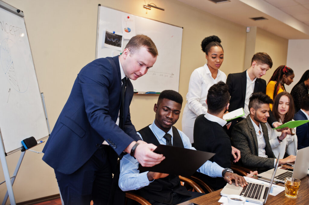 Team collaborating in a workshop setting to develop entrepreneurial skills.