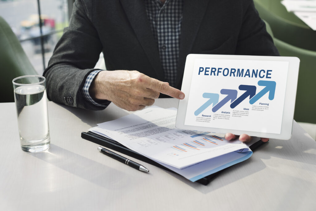 A professional reviewing data, highlighting rising sales performance and strategic growth.