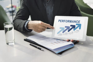 A professional reviewing data, highlighting rising sales performance and strategic growth.